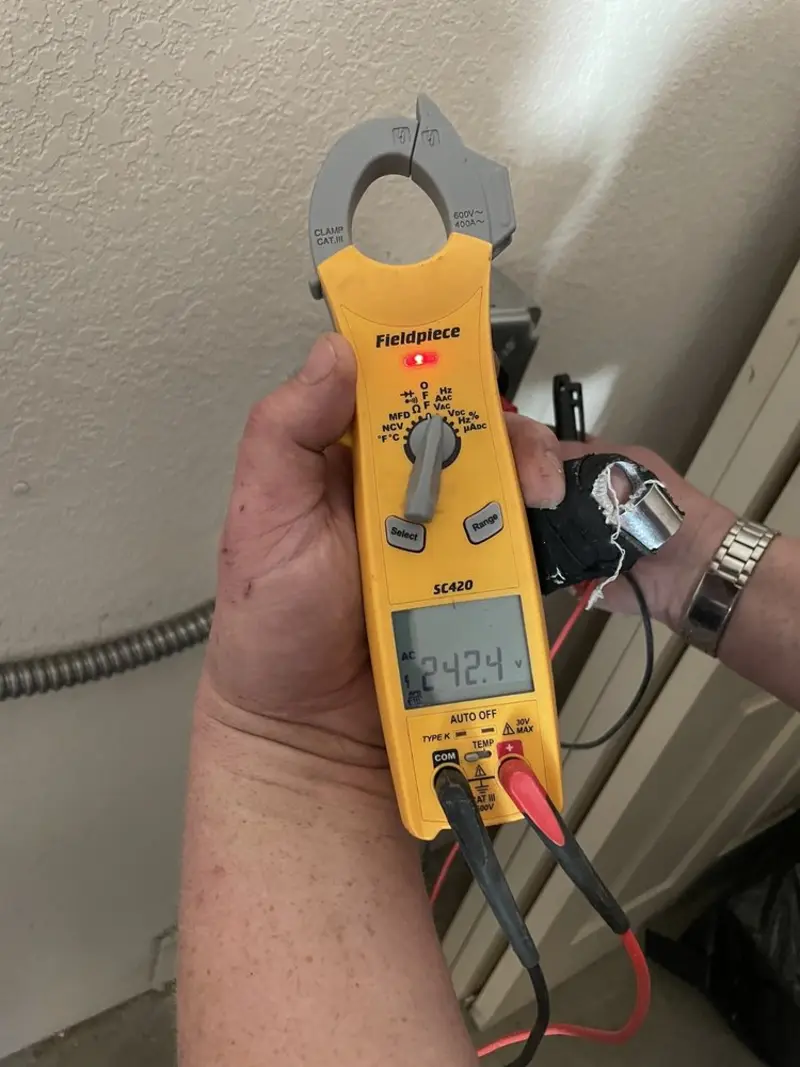 Voltage testing with clamp meter during Electrical Installation Services in Lancaster